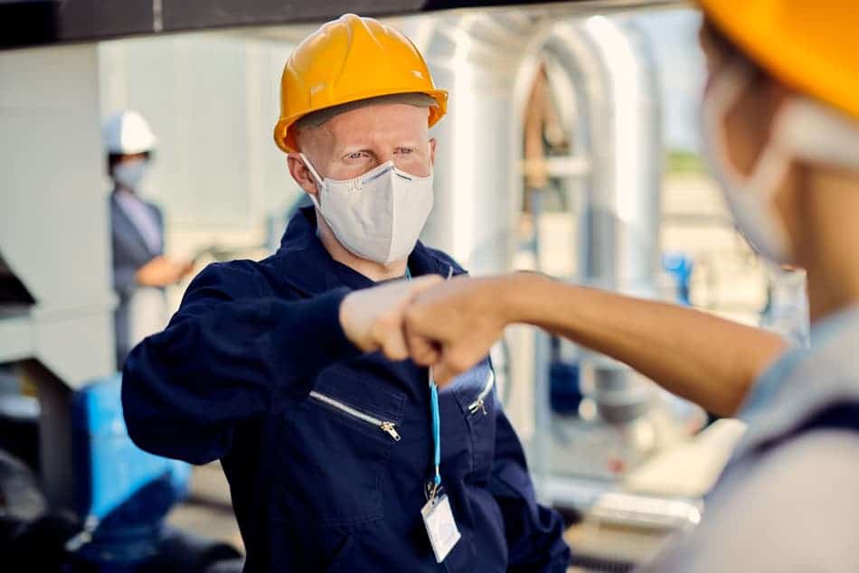 construction workers with face masks fist bumping 2022 10 06 01 36 52 utc 1